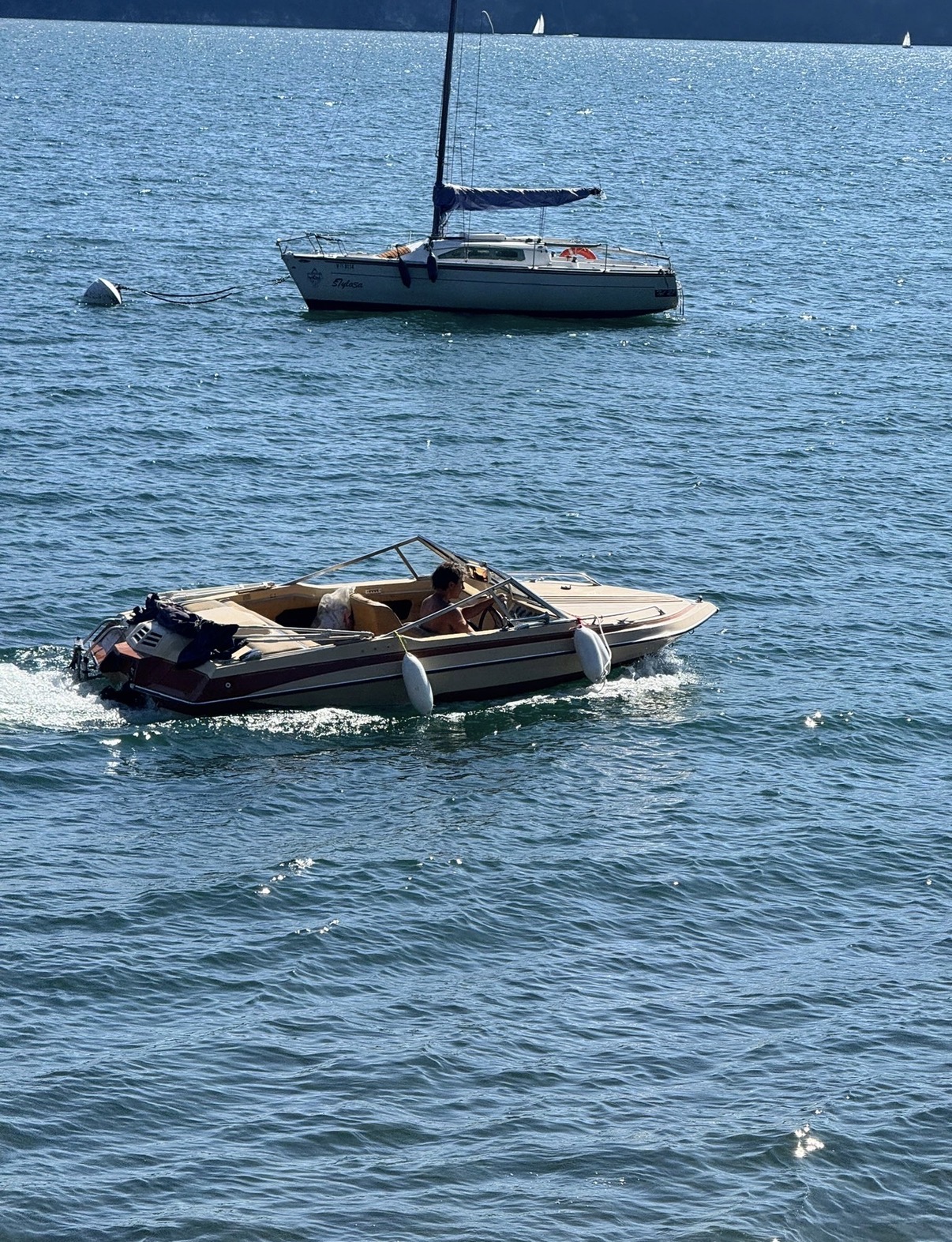 Alexander at the helm of the SSV-164 on Lake Maggiore